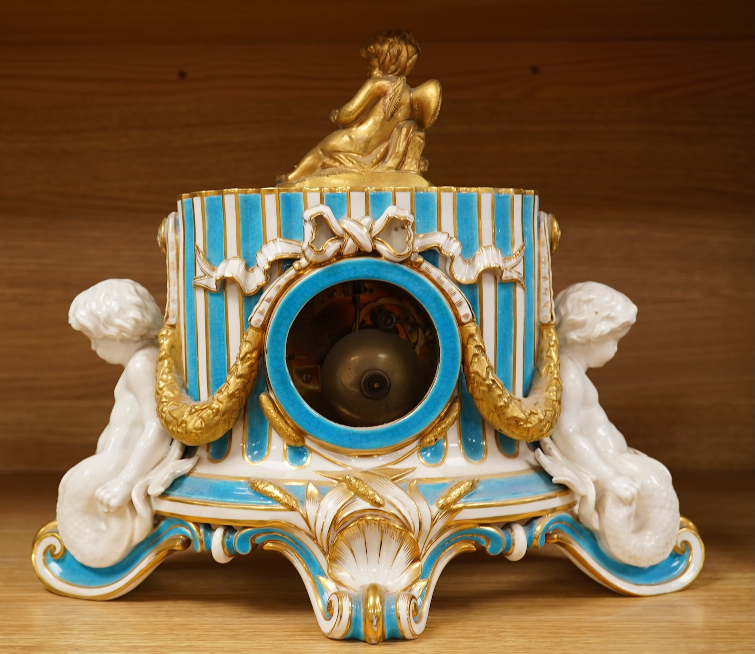 A 19th-century Sevres style porcelain mantel clock, 29cm tall
